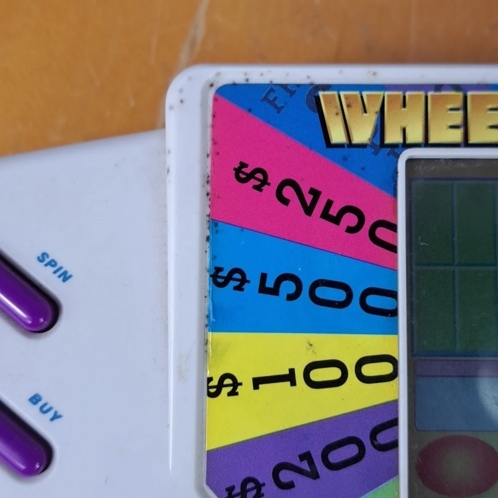Vintage 1999 Tiger Wheel of Fortune hand held electronic game show game Tested